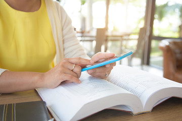 Business women are studying the book in order to plan the market.concept