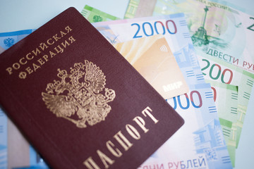 Moscow, Russia- 08 28 2018: Russian passport. The Russian Currency, including the new 2000 ruble-denominated promissory notes. The MIR credit card