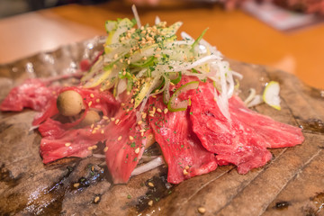 Japanese beef Wagyu grill on the stove with dry leaf
