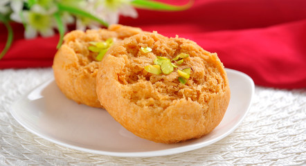 Makhan Bara or Buttery Puff is a famous and delicious sweet food in South Asian Countries