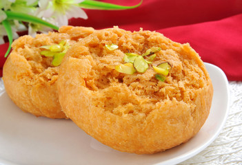 Makhan Bara or Buttery Puff is a famous and delicious sweet food in South Asian Countries
