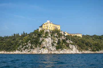 Fototapeta na wymiar Duino castle in Trieste Italy, view from the sea