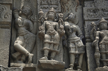 Fototapeta na wymiar Carved figures, outer wall of temple, Near Palasdeo Temple, Ujani Dam, Maharashtra