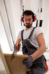 Attractive man doing some woodwork