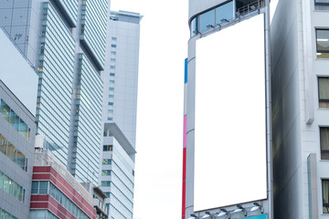 Naklejka premium Blank billboard or advertising poster on the building wall mock up, for advertisement concept background