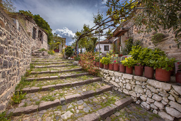 Fototapeta na wymiar Stone stairs with gardens on Lesbos island Greece