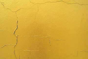 Cement background with a texture of gold wall