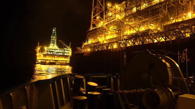 FPSO tanker vessel near Oil platform Rig. Offshore oil and gas industry, sea oil production and storage