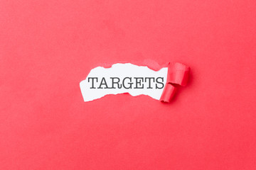 Targets word behind ripped piece of paper