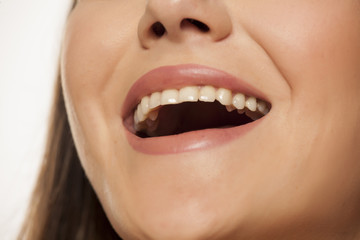 Smiling woman with natural and healthy teeth