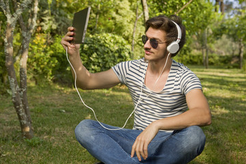 man relaxing with tablet pc