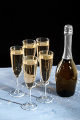 glasses of champagne with the bottle