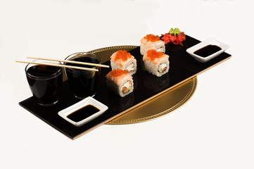 sushi rolls on dish with caviar