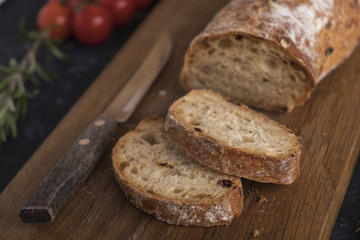 Freshly baked ciabatta bread on wooden tray. Fresh baked bread