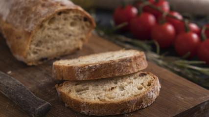 Crusty  ciabatta bread ready to eat. Fresh bread on wooden board