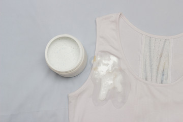 Spot on a white T-shirt filled with stain remover, fighting stains on clothes, white T-shirt,...