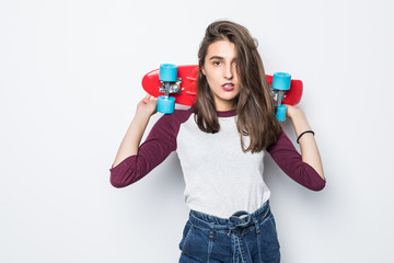 Funny woman posing with skateboard isolated on white background