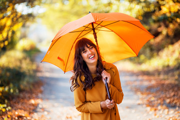 Portrait of beautiful woman with umbrella