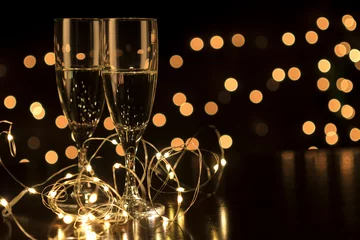 Fotobehang New Year toast champagne led lights,  bokeh lights background © AG Photo Design
