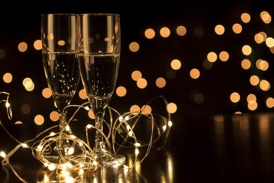 New Year toast champagne led lights,  bokeh lights background