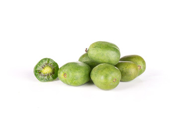 Lot of whole one half of fresh green mini baby kiwi fruit isolated on white background