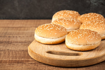 Burger buns on wooden table
