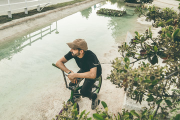 Guy sitting on a bmx bike in the city