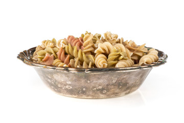 Raw pasta fusilli isolated on white