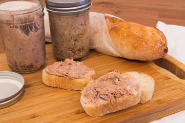 Homemade Rillettes French meat spread made of pork on baguette bread