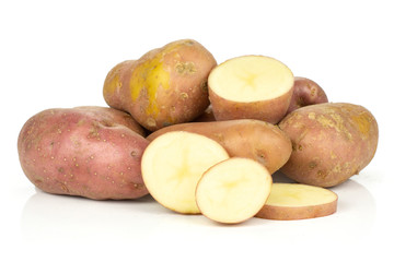 Group of lot of whole one half three slices of fresh red potato francelina variety isolated on white background
