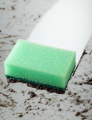 Dirty glass and a sponge .