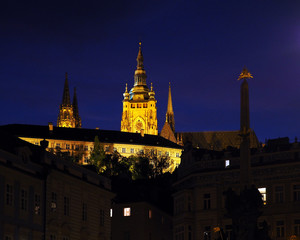 Night Prague, Czech Republic. Prague Castle, Holy Trinity Column, God’s eye placed on top. Lesser Town, square