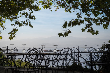Empty tables at a restaurant in Corsica