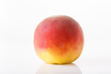 ripe peach isolated on white background