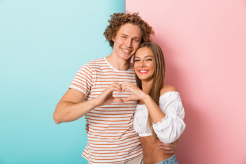 Fototapeta premium Smiling young couple standing
