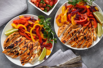 Grilled chicken fillet with sauteed peppers and onion.
