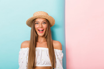 Happy young beautiful woman posing isolated wearing hat.