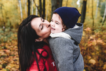 Fototapeta premium happy mather and child in autumn park