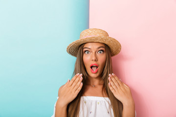 Shocked young beautiful woman posing isolated wearing hat.