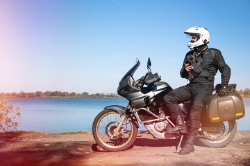 Motorbiker travelling, autumn day, motorcycle off road, rider, adventurer, extreme tourism, cold...