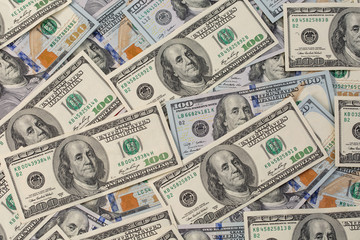 a pile of American paper hundred-dollar bills as an element of the world financial system