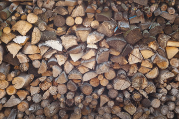 Firewood stacked. Chipped firewood. Background