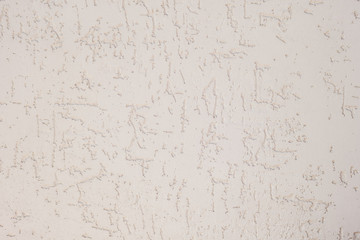 Texture of decorative plaster with a relief. White plaster. Close-up.