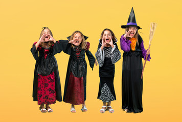 Set of Little girl dressed as a vampire for halloween holidays shouting with mouth wide open on...