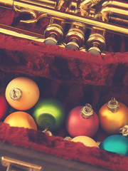 Colorful vintage Christmas baubles with a trumpet
