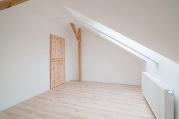 Empty bright attic room.