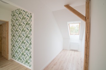 Empty bright attic room.