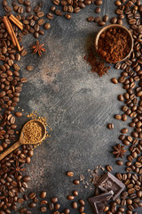 Ground coffee and coffee beans with spices .Top view with copy space.
