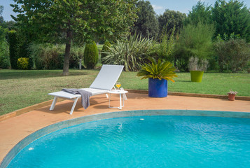 Sun lounger near pool.