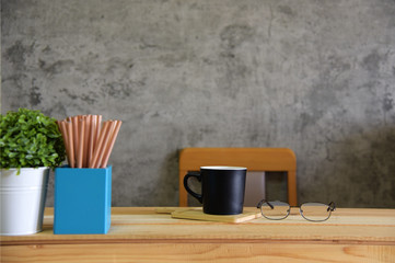 Coffee cup on the desk the room Loft style 